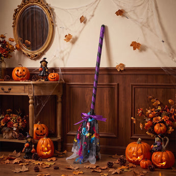 Halloween wand decoration with purple-striped pole and silver patterned tulle pouch