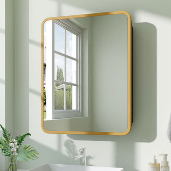 Gold-tone framed rectangular bathroom mirror cabinet on wall with rounded corners