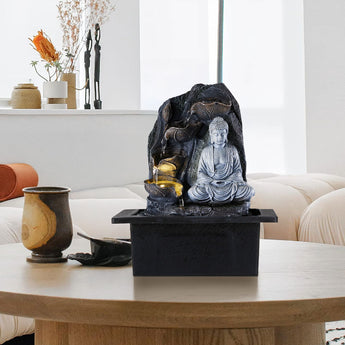 Tabletop Buddha water fountain decor with seated gray Buddha and golden water bowl