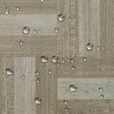Water droplets on wood-effect vinyl floor tile surface, light beige and gray pattern