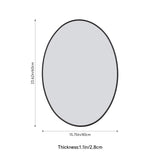 Oval bathroom mirror with black frame and reflective glass for wall mounting