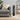 Standing ceramic tower heater in white with black mesh front and digital control panel