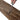 Hand cutting a medium brown wood-effect laminate plank with a utility knife