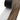 Peel-and-stick laminate plank lifted from backing, medium brown wood texture