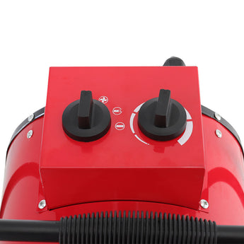 Red patio heater with two black control knobs on top panel