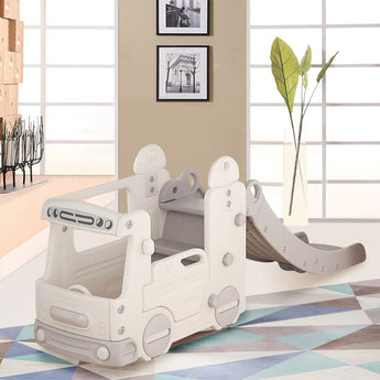 Kids indoor bus playset with slide and white playhouse panels on a rug
