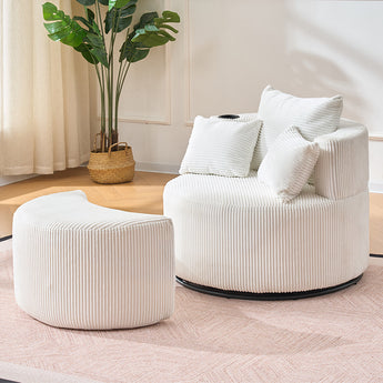 White corduroy swivel accent chair with throw pillows and matching ottoman footstool