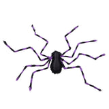 Giant Halloween spider decoration with black body and purple-striped legs, isolated on white