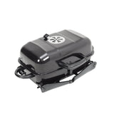Lidded mini charcoal grill in dark gray, hinged lid handle and side supports