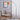 Stehlampe mit orangefarbenem Schirm und schwarzem, gebogenem Stativ