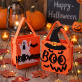 Two orange Halloween treat bags with handles: ghost “Happy Halloween” and witch “Boo”