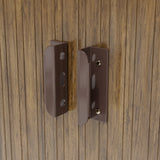 Metal shed door latch and hinges on wood-effect panel