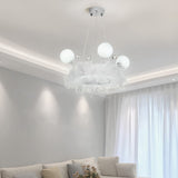 Feather LED pendant light with round opal glass shades and crystal ball details