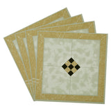 Peel-and-stick floor tiles set with gold border, cream marble pattern, black diamond inset