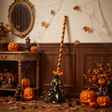 Halloween broom decoration with orange-and-black striped handle and black starry bristles