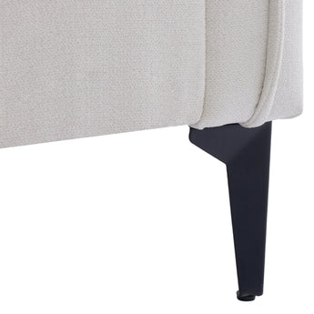 Linen sofa armchair leg detail: tapered black legs under off-white upholstery