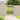 Wooden pedestrian gate with X-brace top and vertical slats, light natural timber