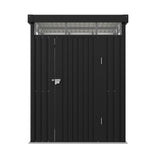 Dark gray metal storage shed wall section with flat roof beam, small handle and vented overhang