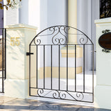 Black wrought iron pedestrian gate with arched top, scrollwork, and vertical bars.