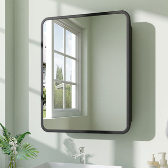 Wall-mounted rectangular bathroom storage mirror cabinet with dark frame on the wall