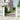 Black wrought iron garden gate with arched top and vertical bars