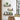 Wall-mounted floating shelves with black metal brackets and light wood boards