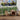 Outdoor porch fence privacy screen with artificial green grape leaf panels and brown lattice