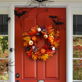 Autumn harvest wreath with orange and red leaves, pinecones, pumpkins, and berries
