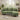 Green L-shaped corner sofa with chaise, three seat cushions, and square armrests.