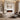 White wall-mounted electric fireplace with orange flame effect