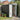 Pent roof metal storage shed with open door showing gardening tools inside
