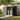 Metal storage shed with open double doors and lock-ready latch, dark grey panels
