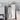 White bathroom toilet roll cabinet with open door and top shelf