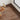 Wood-grain self-adhesive PVC plank flooring, warm medium-brown boards