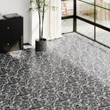 Marble-effect vinyl floor tile in dark gray with white veining, waterproof style