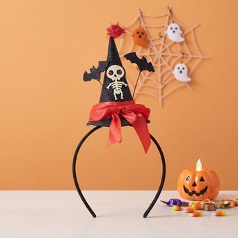 Black Halloween witch headband with skull graphic, red bow, and bat details