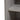Wood cabinet door handle and round knob on light grey front panel