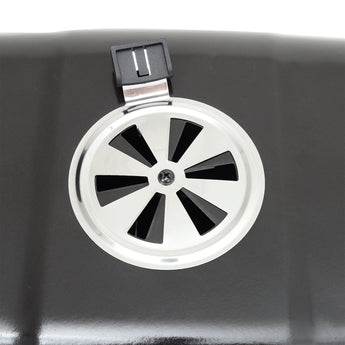 Close-up of lid vent with circular fan design on dark gray grill