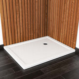White rectangular wetroom tray with circular drain hole, low border