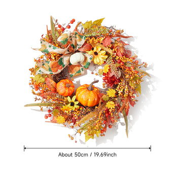 Decorative Halloween wreath with orange pumpkins and multicolor autumn foliage