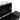 Open black charcoal grill firebox with upper and lower grates and side supports