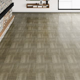 Wood-effect vinyl floor tile in medium gray with herringbone woodgrain texture