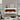 White electric fireplace with flame effect behind open mantel shelves