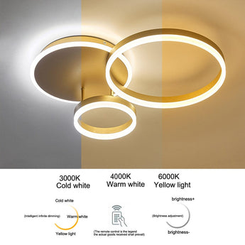 Gold 3-ring LED ceiling light with circular loops, showing color temperature options