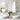 Pair of arch-shaped wall mirrors with gold metal frames above two sinks