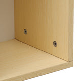Base screws and wood grain on the bottom edge of the storage cabinet