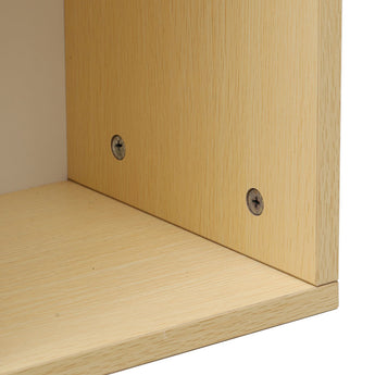 Base screws and wood grain on the bottom edge of the storage cabinet