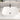 White square countertop sink with tall dark faucet and central chrome drain
