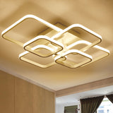 Adjustable semi-recessed LED ceiling fixture with four square rings and integrated mounting