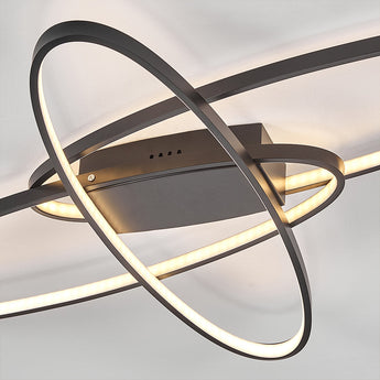 Black LED ceiling light close-up: interlocking ring frame with backplate
